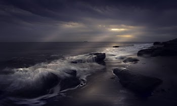 Body of Water Under Gray Sky at Golden Hour