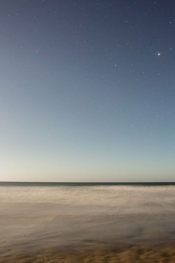 body of water under starry night