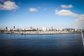 Body of Water With Buildings on Side