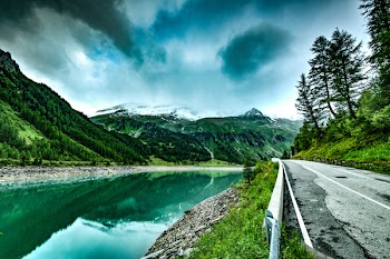 Body of Water With Mountain Valley