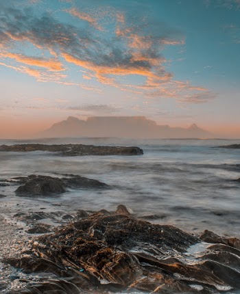 Body Of Water With Sunset View