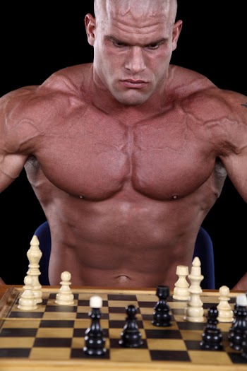 Bodybuilder playing Chess