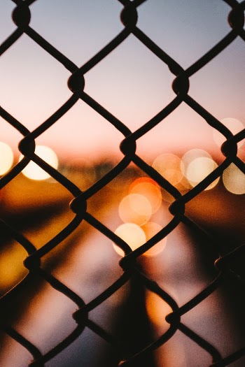 Bokeh behind a fence