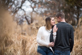 Bokeh Photography of Woman Hugging Man