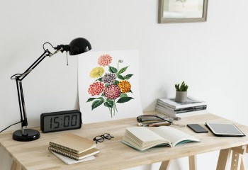 Book Opened on Table and Alarm Clock at 15:00