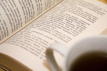 Bookpage Near the White Ceramic Mug