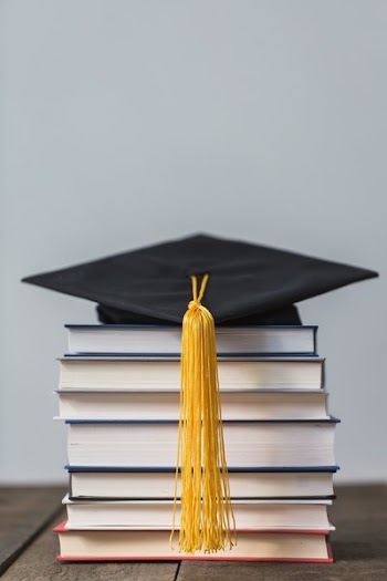 Books And Graduation Cap