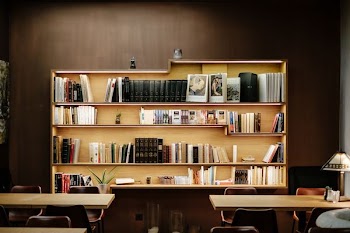 books filled wooden shelf inside room