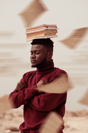 Books on Man's Head