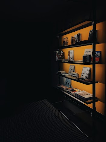 Books on Shelf With Turned-on Light