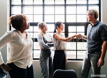Boss shaking hands with a new team member