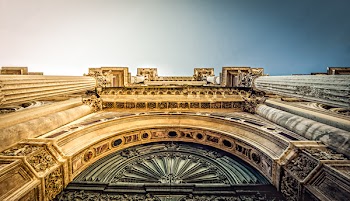 Bottom View of Vintage Arch during Daytime