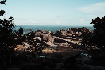 Boulders Near Body of Water