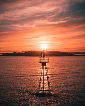 Bouy at Sea during Sunset
