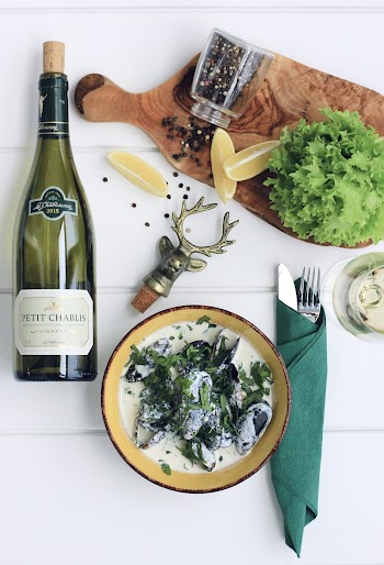 Bowl of Food Beside Wine Glass