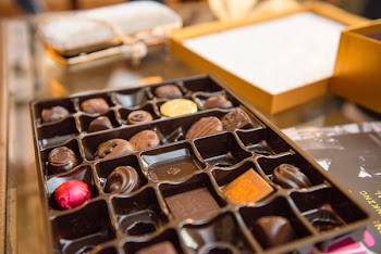 Box of Chocolate on Brown Wooden Surface