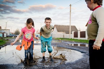 Boy and Girl Playing on Water