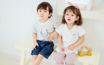 Boy and Girl Sitting on Bench