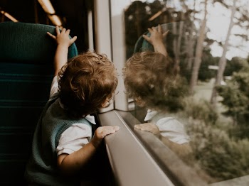 Boy Beside Window Of A vehicle