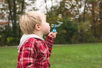 Boy Blowing Bubbles