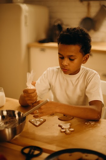 Boy Decorating Cookie