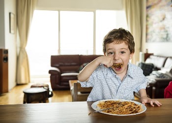 Boy eating spaghetti | Free Photo - rawpixel