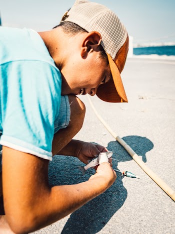Boy Holding A Fish