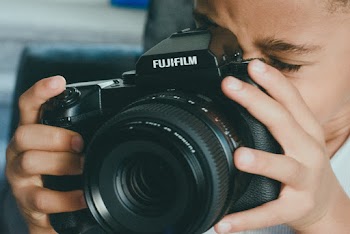 Boy Holding Camera