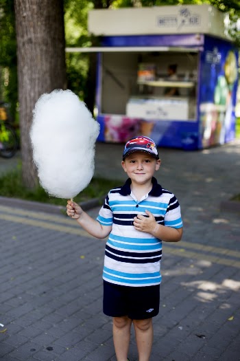 Boy Holding Cotton Candy At The Park