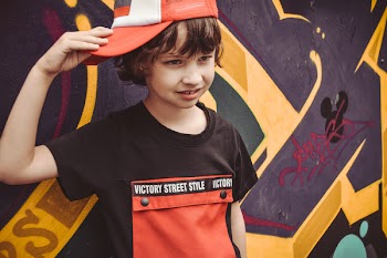 Boy Holding His Hat