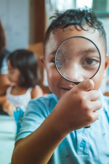 Boy Holding Magnifying Glass