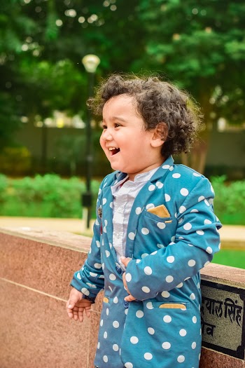 Boy in Blue and White Polka-dot Coat