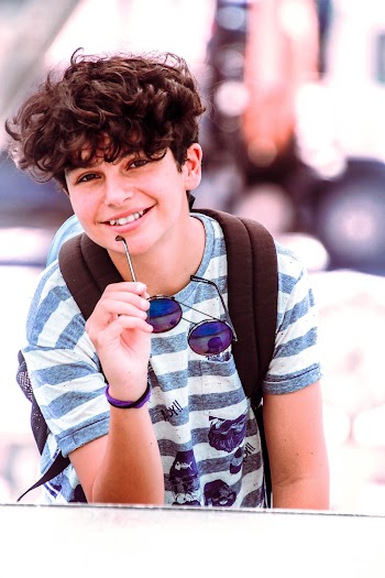 Boy in Blue and White Striped Shirt