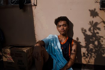 Boy Leaning on Wall