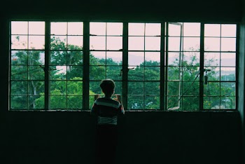 Boy Near Window