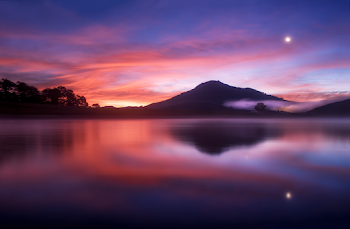 Boy of Water Under Blue and Red Sky