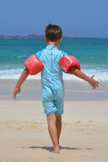Boy on Blue Onesie on Beach during Day