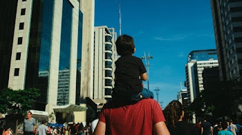 Boy On Man's Shoulders