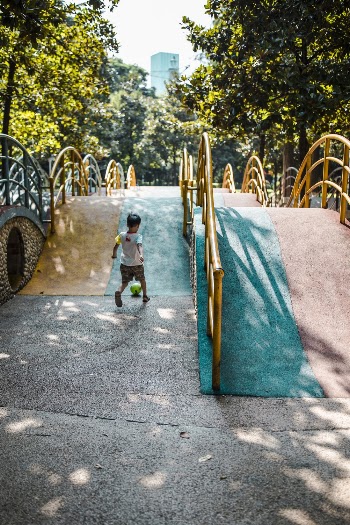 Boy Playing on Ground