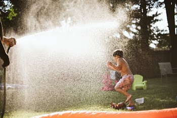 Boy Playing On Lawn