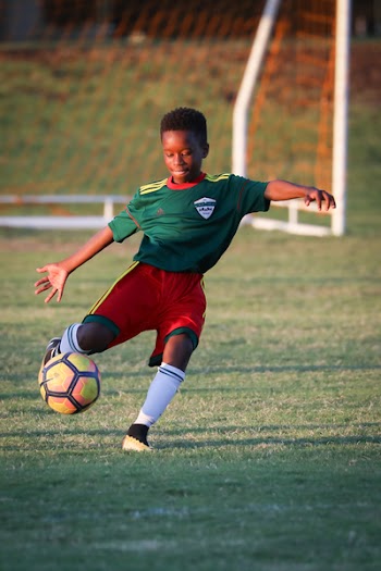 Boy Playing Soccer