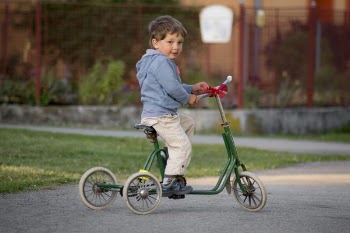 Boy Riding Green bike