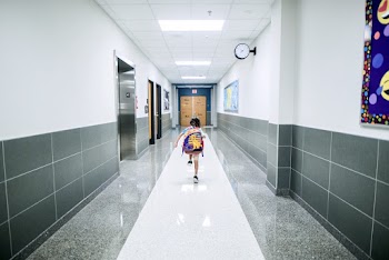 Boy Running In The Hallway