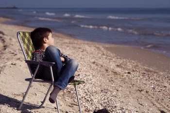 Boy Sitting on Chair