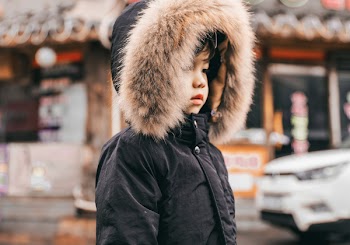 Boy Wearing Black Faux-Fur-Lined Hooded Parka