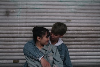 Boy Wearing Blue Denim Jacket and Embrace Woman Wearing Jacket