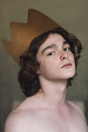 boy wearing crown