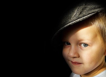 Boy Wearing Herringbone Flat Cap