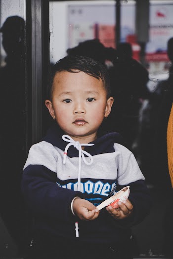 Boy Wearing White and Blue Long-sleeved Shirt