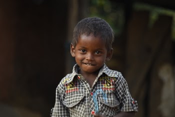 Boy Wearing White and Multicolored Collared Shirt in Selective Focus Photography